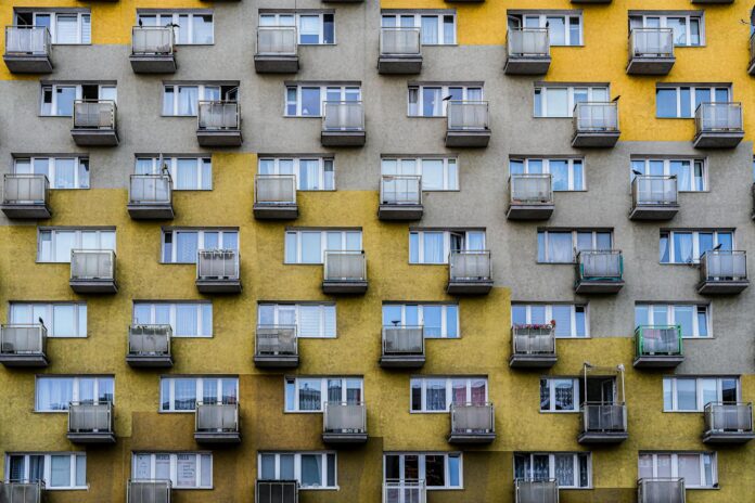 Detailed view of a residential building facade with balconies in Gdynia, Poland.